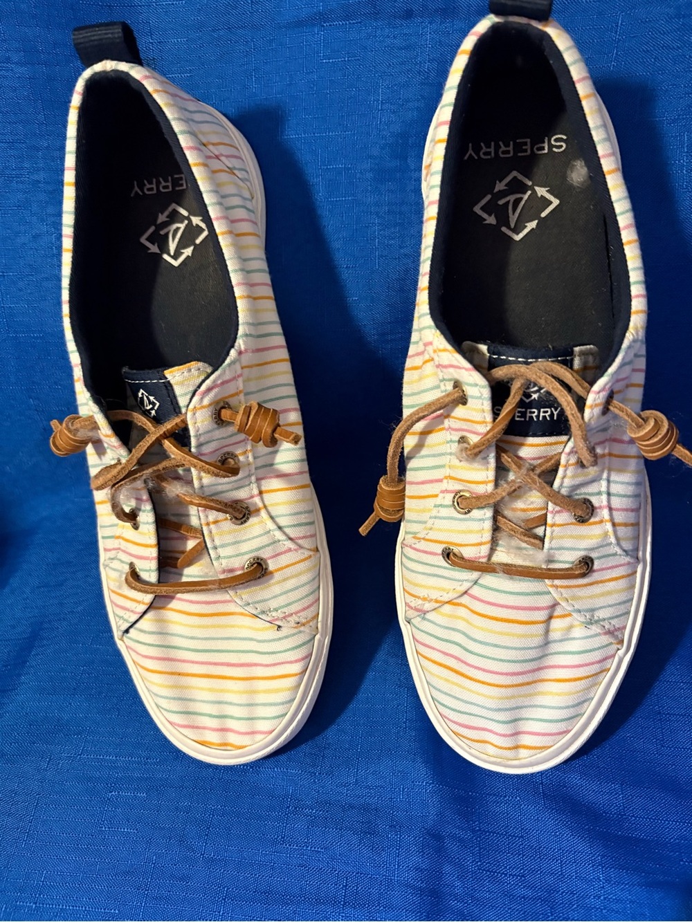 Sperry canvas multicolored stripes off white background sneakers